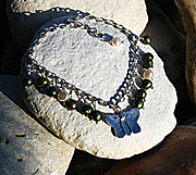 Sterling silver butterfly bracelet with green and white freshwater pearls